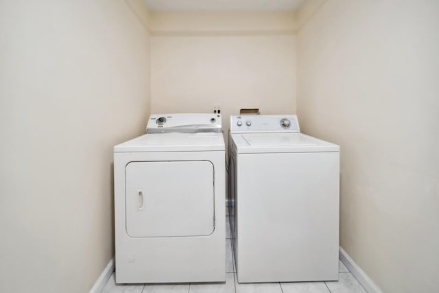 3348 N Narragansett Ave, Chicago, IL 60634 - laundry room with washing machine and clothes dryer and light tile patterned floors