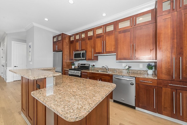 5010 W Lawrence Ave Unit 3B, Chicago, IL 60630 - kitchen with stainless steel appliances, light wood-style floors, a kitchen island, recessed lighting, and crown molding
