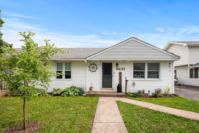 4631W W 88th St, Hometown, IL 60456 - view of front of property with a front yard and roof with shingles
