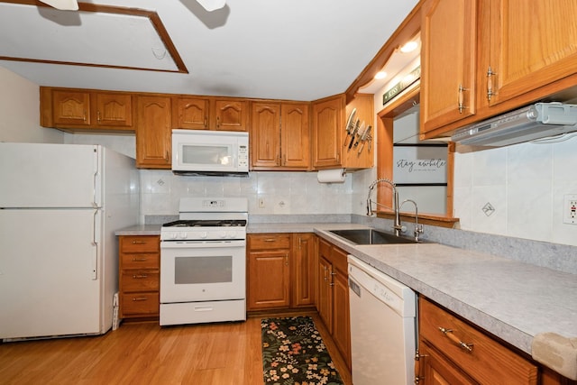 4631W W 88th St, Hometown, IL 60456 - kitchen with white appliances, brown cabinets, light wood-type flooring, backsplash, and light countertops