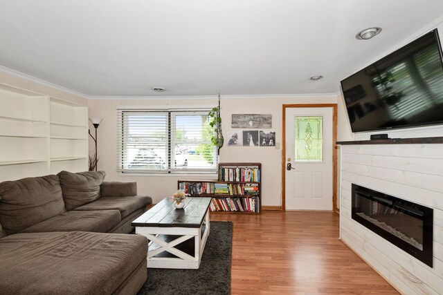 4631W W 88th St, Hometown, IL 60456 - living room featuring ornamental molding, wood finished floors, and a tiled fireplace