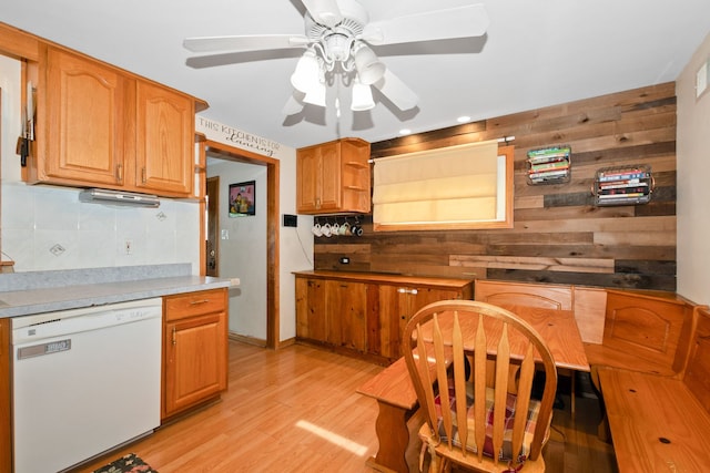 4631W W 88th St, Hometown, IL 60456 - kitchen featuring white dishwasher, wood walls, a ceiling fan, light wood-style flooring, and backsplash