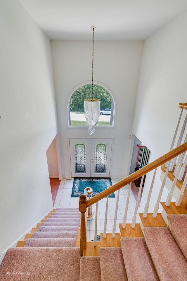 20825 Brookside Blvd, Olympia Fields, IL 60461 - stairway with a high ceiling, a chandelier, and french doors