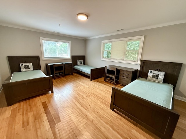 408 Sauk Trl, Park Forest, IL 60466 - bedroom with crown molding, multiple windows, and light wood finished floors