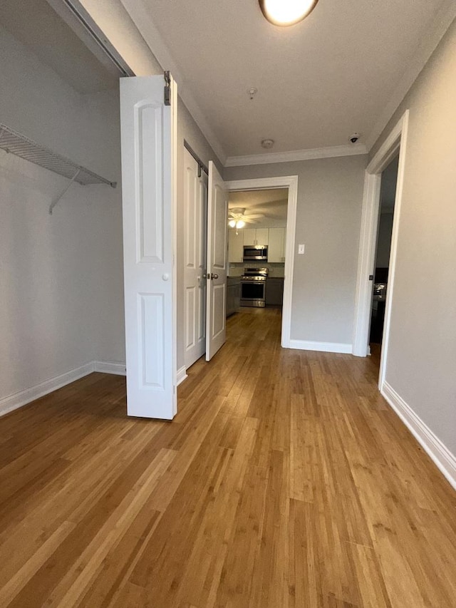 408 Sauk Trl, Park Forest, IL 60466 - hallway featuring light wood-style floors and ornamental molding