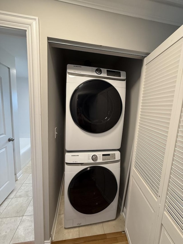 408 Sauk Trl, Park Forest, IL 60466 - washroom with stacked washing machine and dryer and light tile patterned flooring