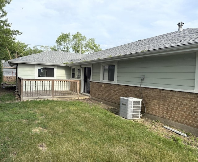 408 Sauk Trl, Park Forest, IL 60466 - rear view of house featuring a yard, roof with shingles, brick siding, and a deck