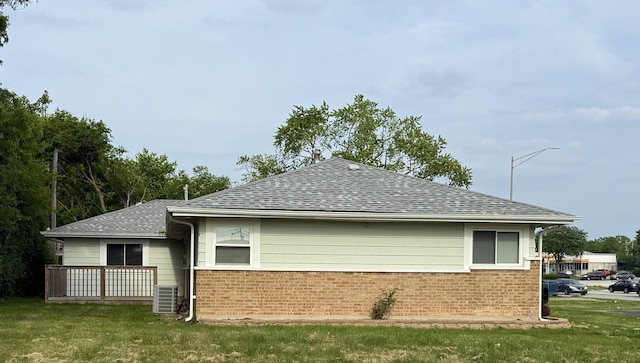 408 Sauk Trl, Park Forest, IL 60466 - view of side of property with brick siding, a shingled roof, and a lawn