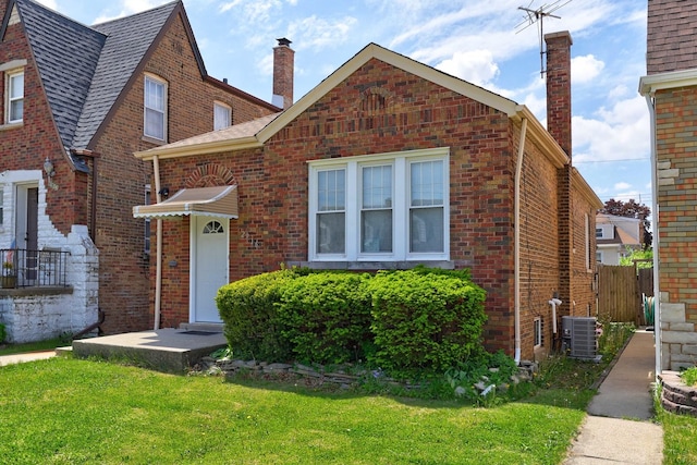 2916 N Melvina Ave, Chicago, IL 60634 - view of front of home with a chimney and brick siding