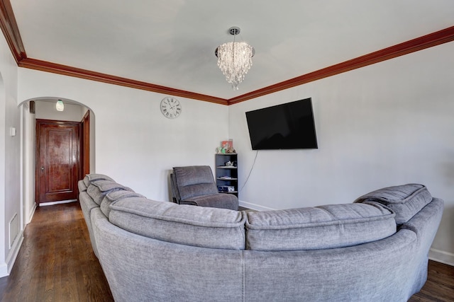 2916 N Melvina Ave, Chicago, IL 60634 - living room featuring arched walkways, a chandelier, dark wood-style floors, and ornamental molding