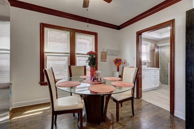 2916 N Melvina Ave, Chicago, IL 60634 - dining space featuring wood finished floors, crown molding, a ceiling fan, and healthy amount of natural light