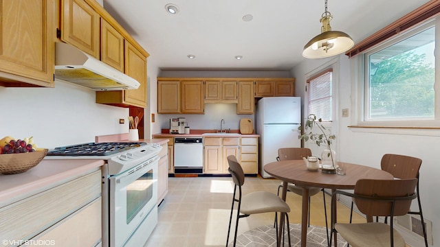80 E Fremont Ave, Des Plaines, IL 60016 - kitchen with white appliances, under cabinet range hood, light countertops, light floors, and pendant lighting