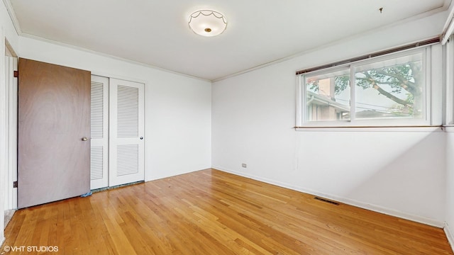 80 E Fremont Ave, Des Plaines, IL 60016 - unfurnished bedroom featuring light wood-type flooring, a closet, and ornamental molding