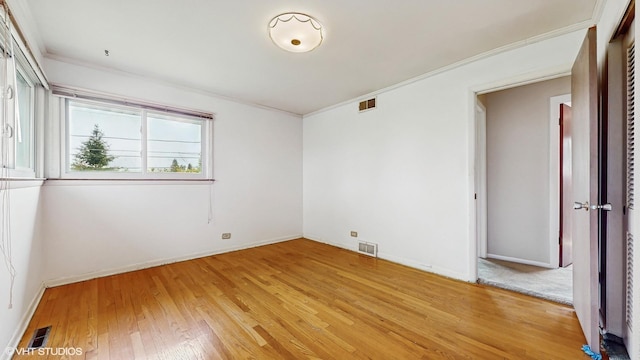 80 E Fremont Ave, Des Plaines, IL 60016 - spare room featuring ornamental molding and light wood-type flooring