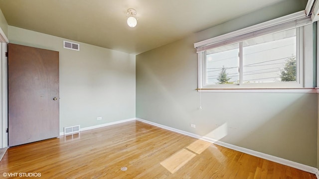 80 E Fremont Ave, Des Plaines, IL 60016 - spare room with baseboards and wood finished floors