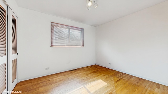80 E Fremont Ave, Des Plaines, IL 60016 - unfurnished bedroom with a closet and light wood-style floors