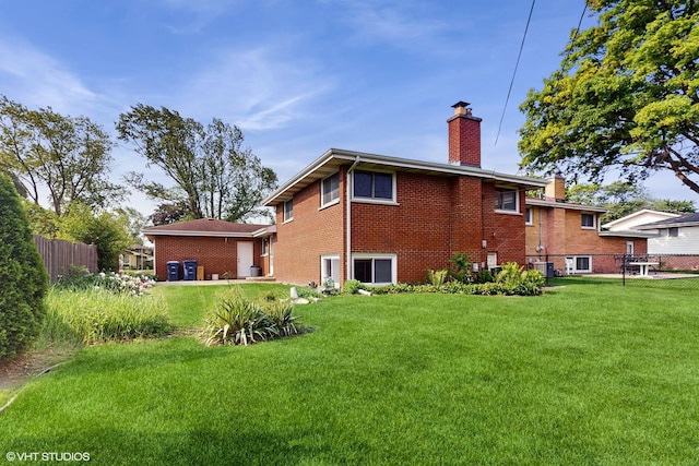 80 E Fremont Ave, Des Plaines, IL 60016 - rear view of house featuring a chimney and brick siding