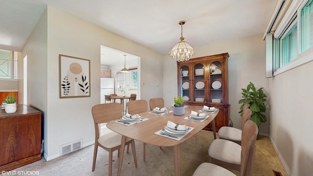 80 E Fremont Ave, Des Plaines, IL 60016 - dining room featuring a chandelier and light carpet