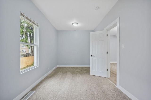 6721 S Ada St, Chicago, IL 60636 - spare room with light carpet and a smoke detector
