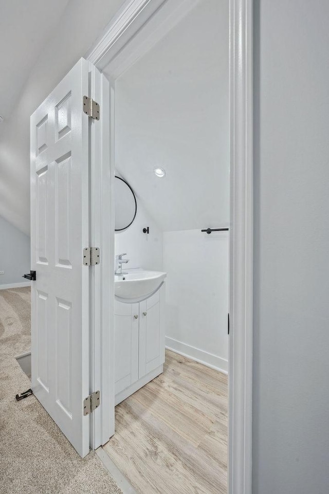 6721 S Ada St, Chicago, IL 60636 - bathroom featuring vanity, lofted ceiling, and wood finished floors