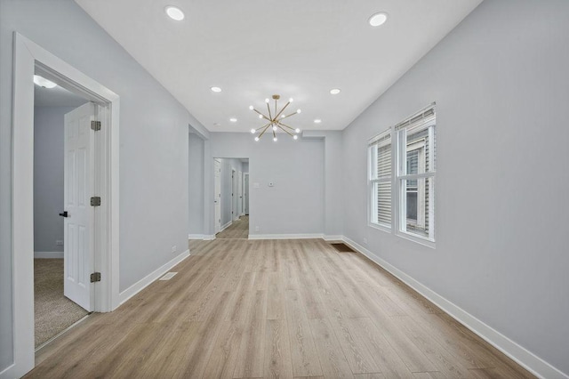 6721 S Ada St, Chicago, IL 60636 - empty room featuring a chandelier, light wood finished floors, and recessed lighting