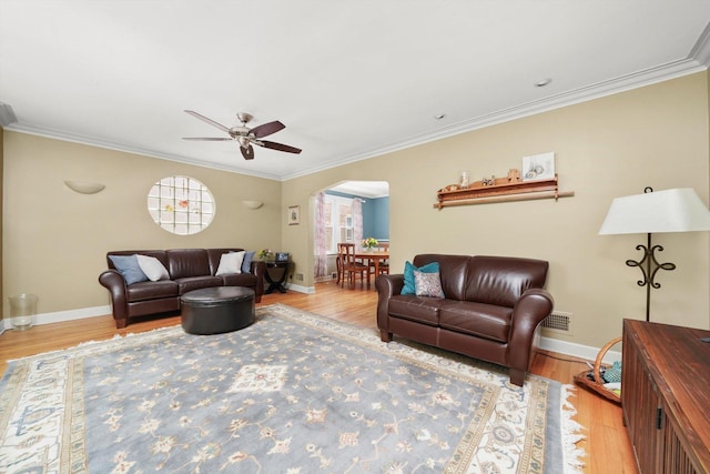 3010 Wisconsin Ave, Berwyn, IL 60402 - living room featuring arched walkways, wood finished floors, a ceiling fan, and ornamental molding