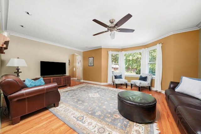 3010 Wisconsin Ave, Berwyn, IL 60402 - living area featuring arched walkways, a ceiling fan, light wood-style flooring, and crown molding