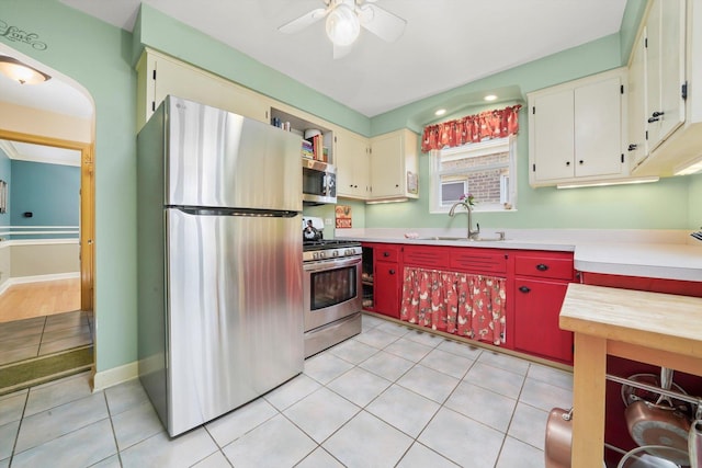 3010 Wisconsin Ave, Berwyn, IL 60402 - kitchen featuring stainless steel appliances, light countertops, ceiling fan, and light tile patterned floors