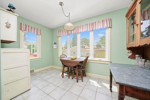3010 Wisconsin Ave, Berwyn, IL 60402 - dining room featuring baseboards and light tile patterned floors