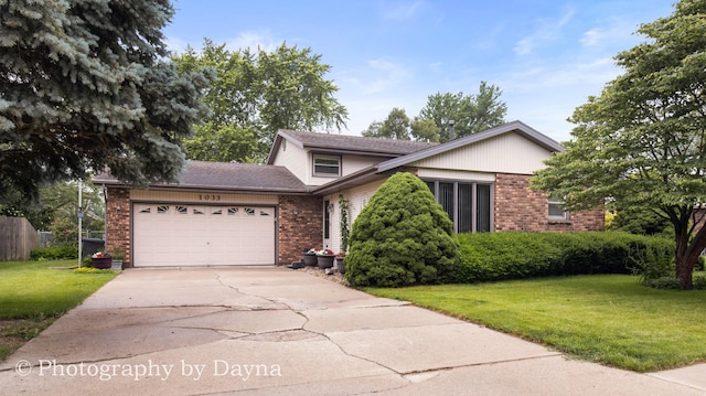 1033 Pheasant Dr, Bradley, IL 60915 - view of front of property with brick siding, an attached garage, a front lawn, and driveway
