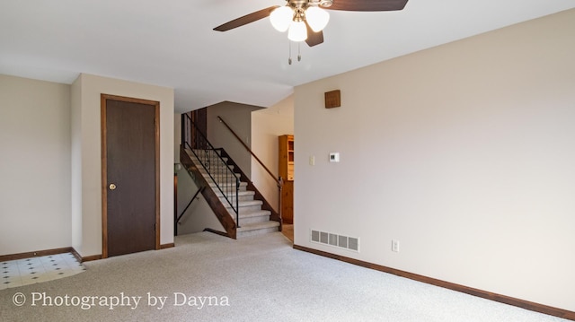 1033 Pheasant Dr, Bradley, IL 60915 - empty room with ceiling fan, stairs, and carpet flooring