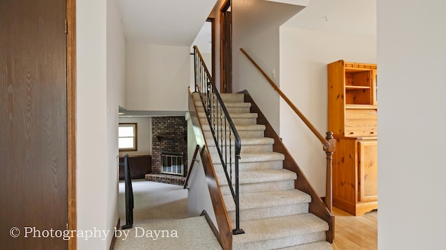 1033 Pheasant Dr, Bradley, IL 60915 - staircase with a fireplace and wood finished floors
