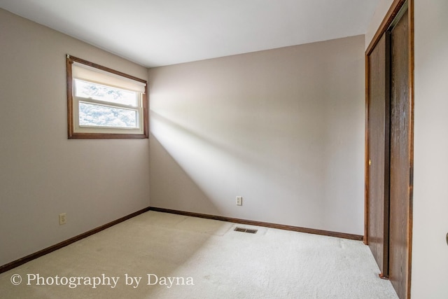 1033 Pheasant Dr, Bradley, IL 60915 - unfurnished bedroom featuring light carpet and a closet