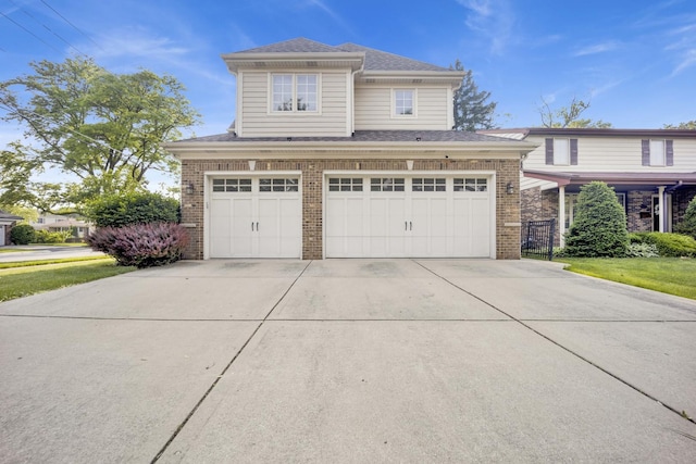 445 E Crescent Ave, Elmhurst, IL 60126 - view of front of property featuring brick siding, concrete driveway, an attached garage, and roof with shingles