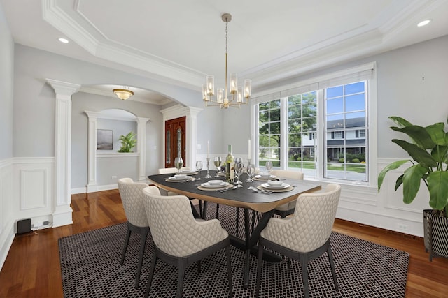 445 E Crescent Ave, Elmhurst, IL 60126 - dining area featuring ornate columns, a tray ceiling, a chandelier, wood finished floors, and wainscoting