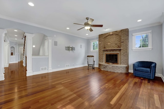 445 E Crescent Ave, Elmhurst, IL 60126 - unfurnished living room featuring ornate columns, a ceiling fan, a fireplace, wood finished floors, and recessed lighting