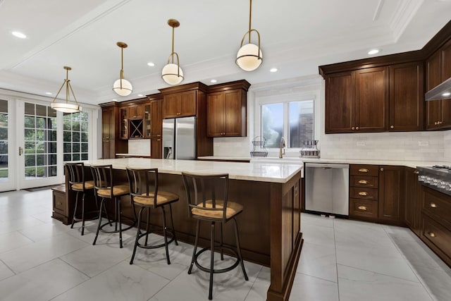 445 E Crescent Ave, Elmhurst, IL 60126 - kitchen featuring appliances with stainless steel finishes, crown molding, tasteful backsplash, light marble finish flooring, and a spacious island