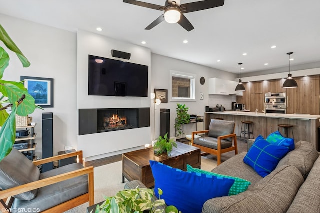 2224 N Seeley Ave Unit 2, Chicago, IL 60647 - living room with a ceiling fan, recessed lighting, a glass covered fireplace, and light wood finished floors