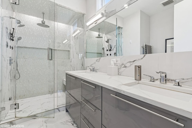 2224 N Seeley Ave Unit 2, Chicago, IL 60647 - bathroom with a marble finish shower, double vanity, and marble tiled flooring