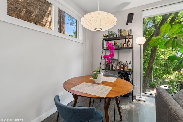 2224 N Seeley Ave Unit 2, Chicago, IL 60647 - dining area with healthy amount of natural light, wood finished floors, and a dry bar