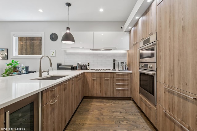 2224 N Seeley Ave Unit 2, Chicago, IL 60647 - kitchen featuring modern cabinets, dark wood-style flooring, wine cooler, light countertops, and recessed lighting