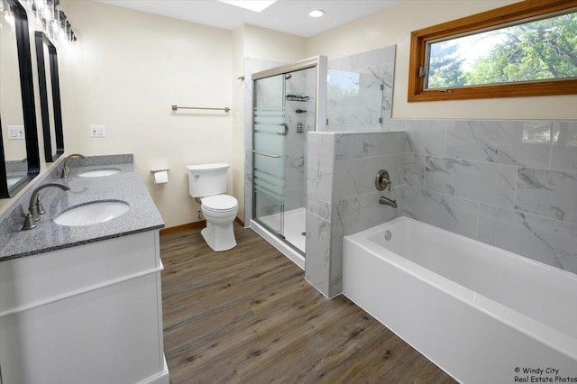 590 Woodcrest Ct, Carol Stream, IL 60188 - bathroom with a garden tub, wood finished floors, double vanity, a shower stall, and recessed lighting