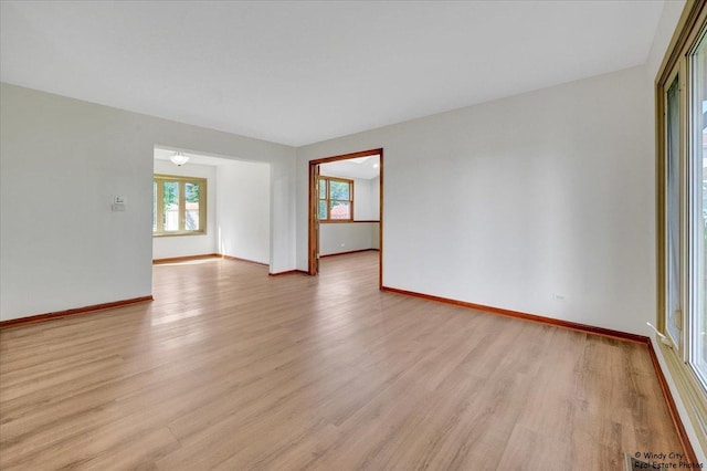 590 Woodcrest Ct, Carol Stream, IL 60188 - empty room with light wood-type flooring and baseboards