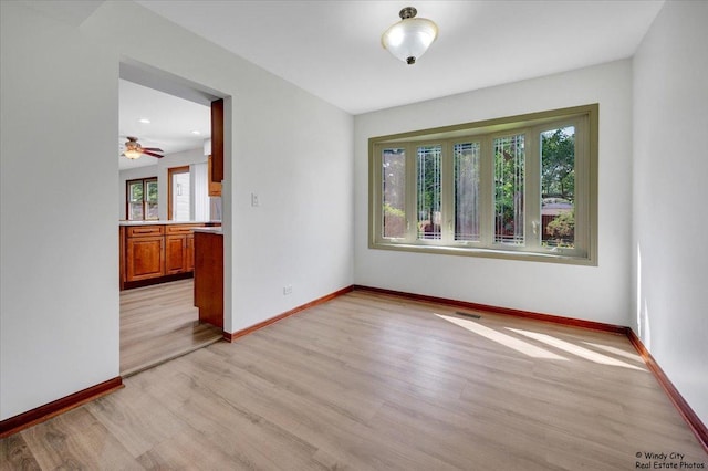 590 Woodcrest Ct, Carol Stream, IL 60188 - unfurnished room with healthy amount of natural light and light wood-style floors
