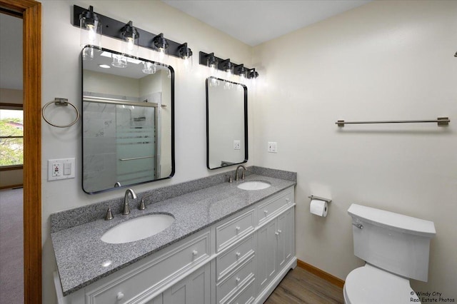 590 Woodcrest Ct, Carol Stream, IL 60188 - full bath featuring a stall shower, double vanity, and wood finished floors