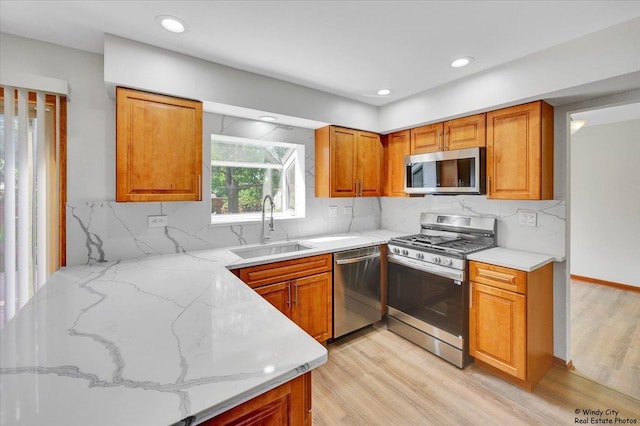 590 Woodcrest Ct, Carol Stream, IL 60188 - kitchen featuring appliances with stainless steel finishes, light wood finished floors, brown cabinetry, and recessed lighting