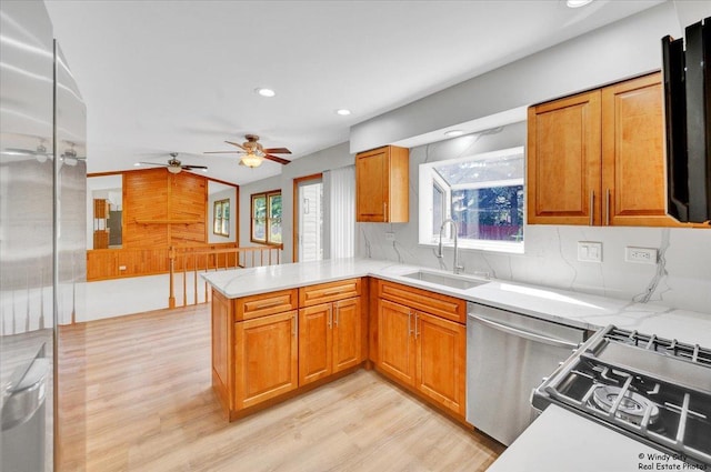 590 Woodcrest Ct, Carol Stream, IL 60188 - kitchen with a peninsula, light wood-style floors, healthy amount of natural light, recessed lighting, and ceiling fan