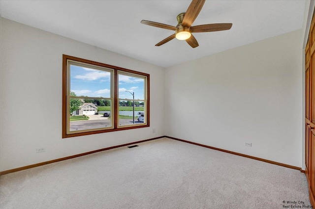 590 Woodcrest Ct, Carol Stream, IL 60188 - unfurnished room with light carpet and a ceiling fan