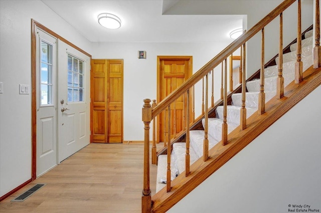 590 Woodcrest Ct, Carol Stream, IL 60188 - foyer entrance featuring light wood finished floors and stairway