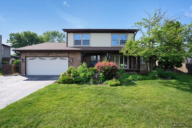 590 Woodcrest Ct, Carol Stream, IL 60188 - view of front of house featuring driveway, a garage, and brick siding